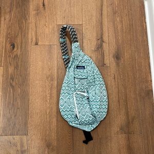 KAVU Rope Sling Crossbody Bag in a teal/blue pattern.